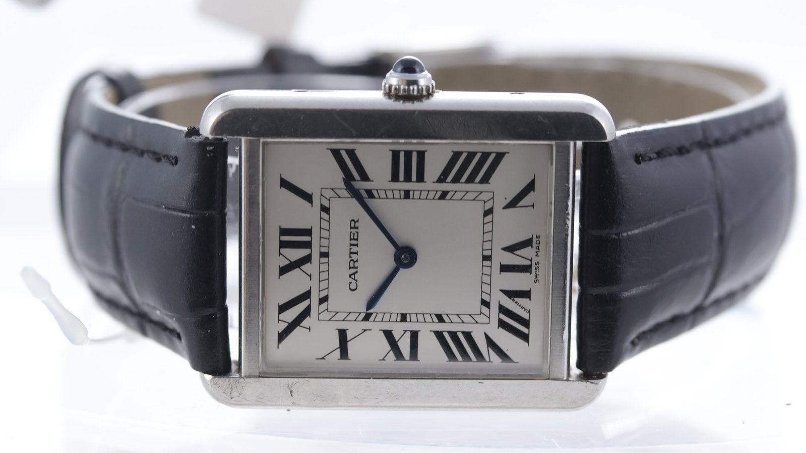 Cartier Tank Solo Quartz Ref 2715: Brand: Cartier Model Name: Tank Solo Reference: 2715 Movement type: Quartz Movement calibre: Cartier 690 Dial shape: Rectangular Dial colour: Silver Dial features: Blue steel hands. Black roman numera