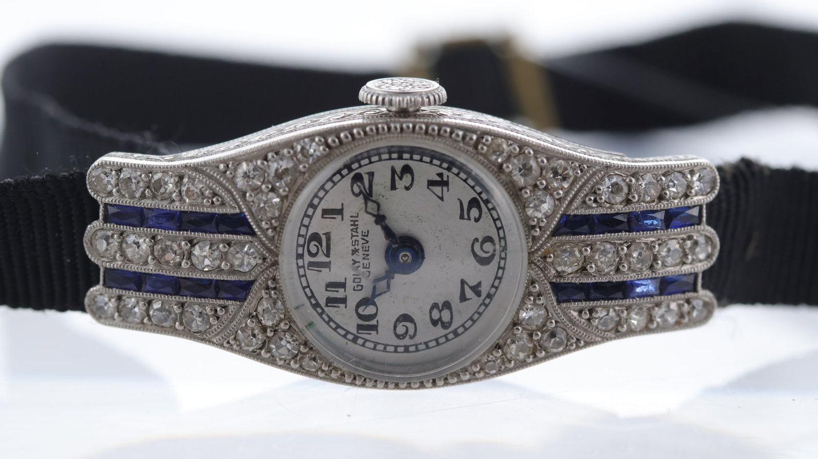 Golay & Stahl Geneve Art Deco Diamond and Sapphire Set Cocktail Watch: Golay & Stahl Geneve Art Deco Diamond and Sapphire set Cocktail Watch, Arabic numerals, gun metal blue hands, curved case with integrated lugs, old cut diamond and calibre cut sapphires, case with con