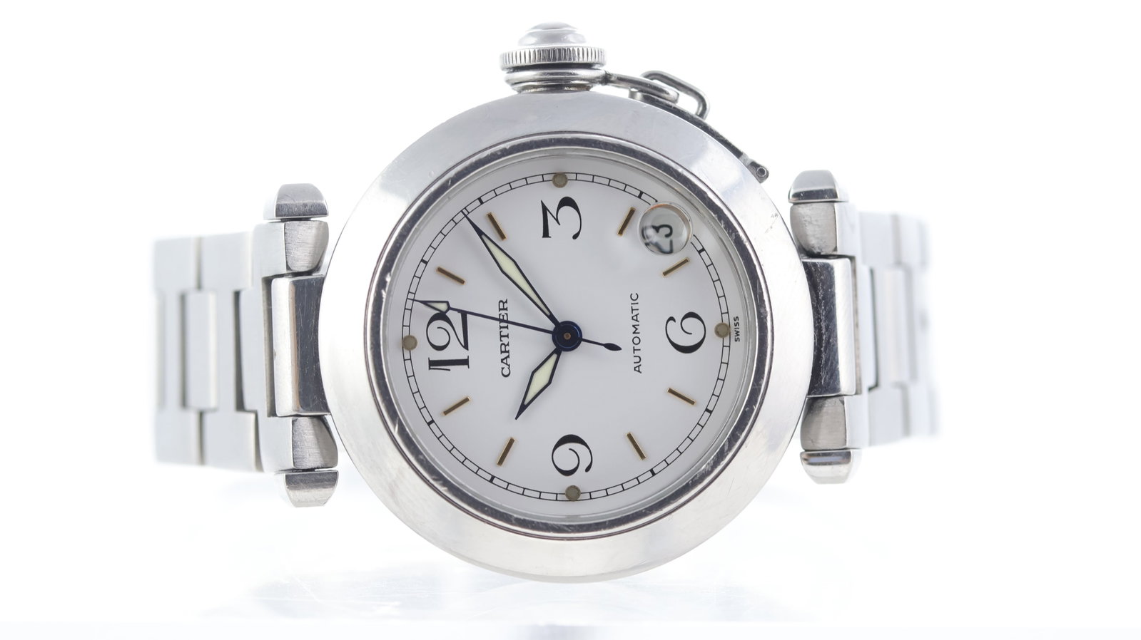 Cartier Pasha Automatic Ref 2324: Brand: Cartier Model Name: Pasha Reference: 2324 Movement type: Automatic Dial shape: Circular Dial colour: White Dial features: Gilt baton/black arabic numeral hour markers. Date aperture at 4:30 ocl