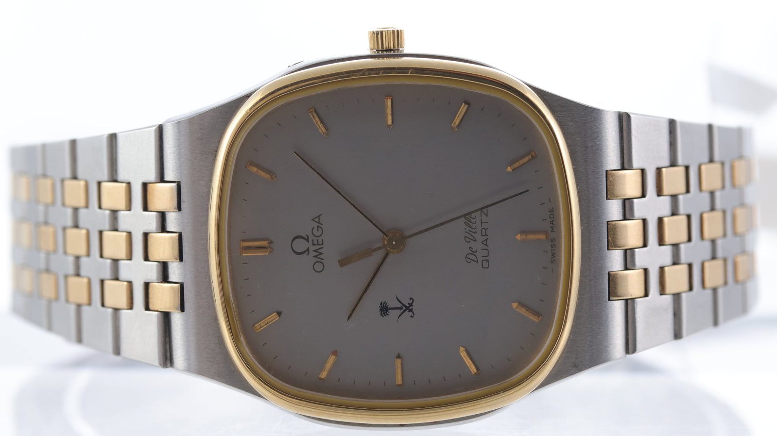 Omega De Ville 'Saudi Dial' Quartz Ref 1950016 Circa 1980: Brand: Omega Model Name: De Ville Reference: 1950016 Movement type: Quartz Movement calibre: Omega 1336 Year: Circa 1980 Dial shape: Cushion Dial colour: Silver Dial features: Gilt hands and applied '