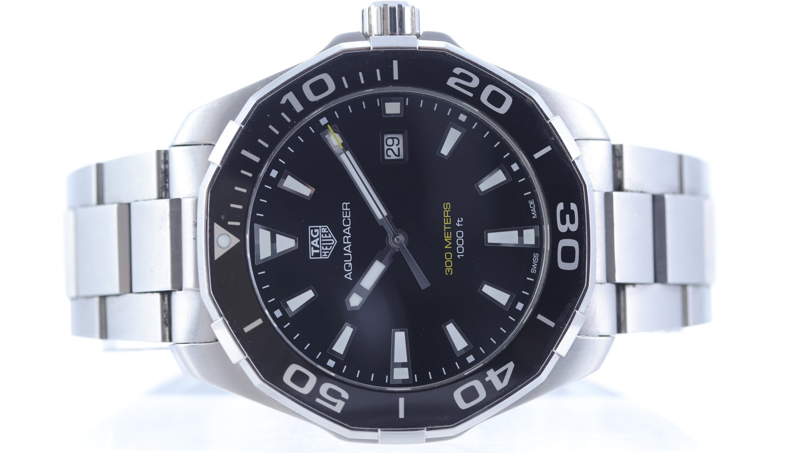 Tag Heuer Aquaracer Quartz Ref WAY101A: Brand: Tag Heuer Model Name: Aquaracer Reference: WAY101A Movement type: Quartz Dial shape: Circular Dial colour: Black Dial features: Applied trapezium hour markers with lume inserts. yellow accents.