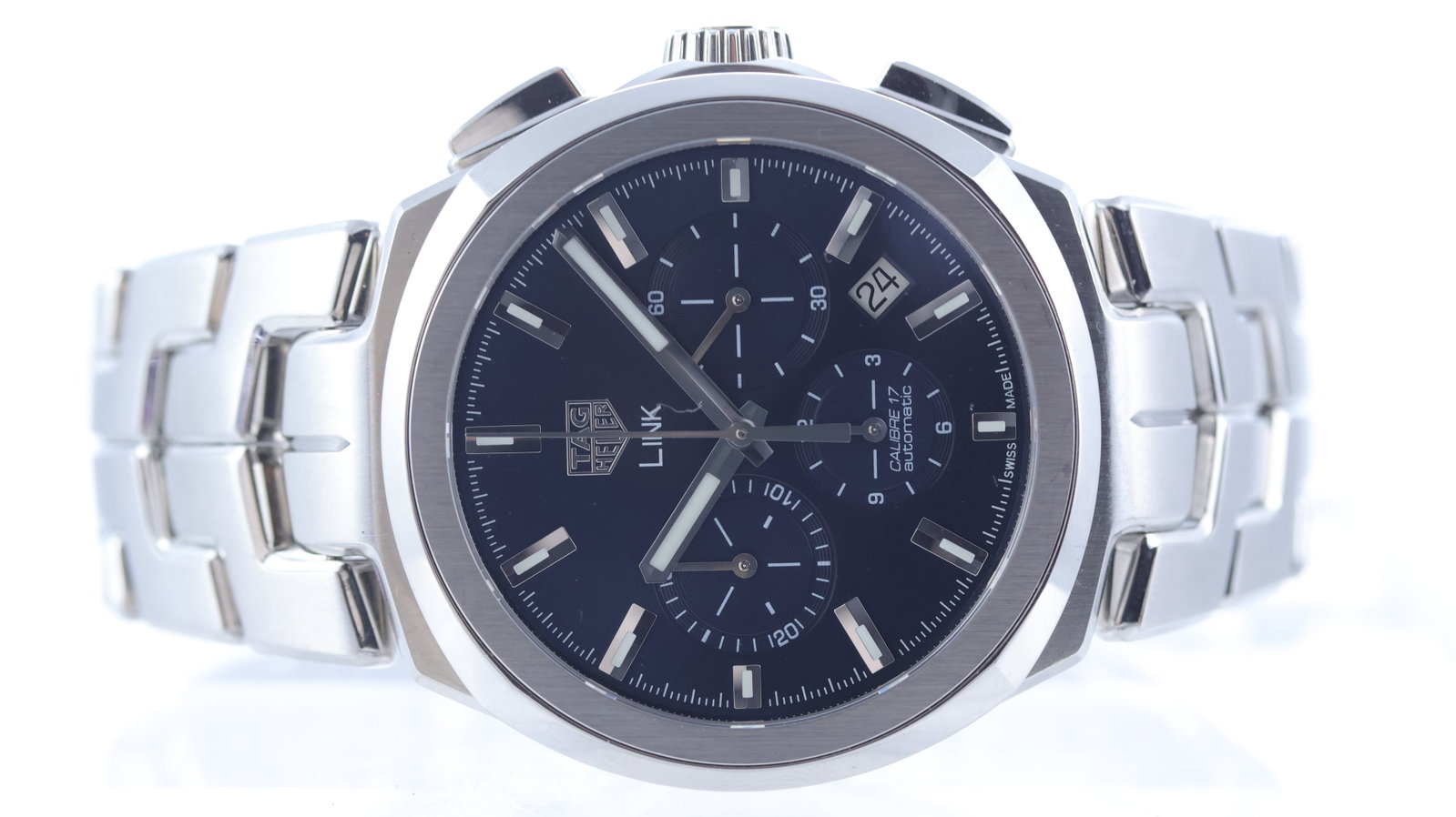 Tag Heuer Link calibre 17 Chronograph Ref CBC2112: Brand: Tag Heuer Model Name: Link Reference: CBC2112 Movement type: Automatic Movement calibre: Tag Heuer 17 Dial shape: Circular Dial colour: Blue Dial features: Sunburst dial with applied, faceted h