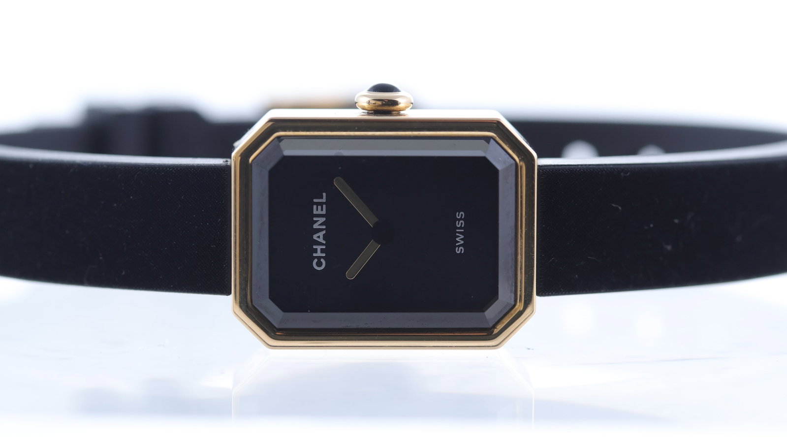 Chanel Premiere Ribbon 18ct rose gold & Titanium: Brand: Chanel Model Name: Premiere Ribbon Movement type: Quartz Dial shape: Octagonal Dial colour: Black Case size: 19.7mm Case material: 18ct rose gold Case features: Cabochon crown, octagonal facete