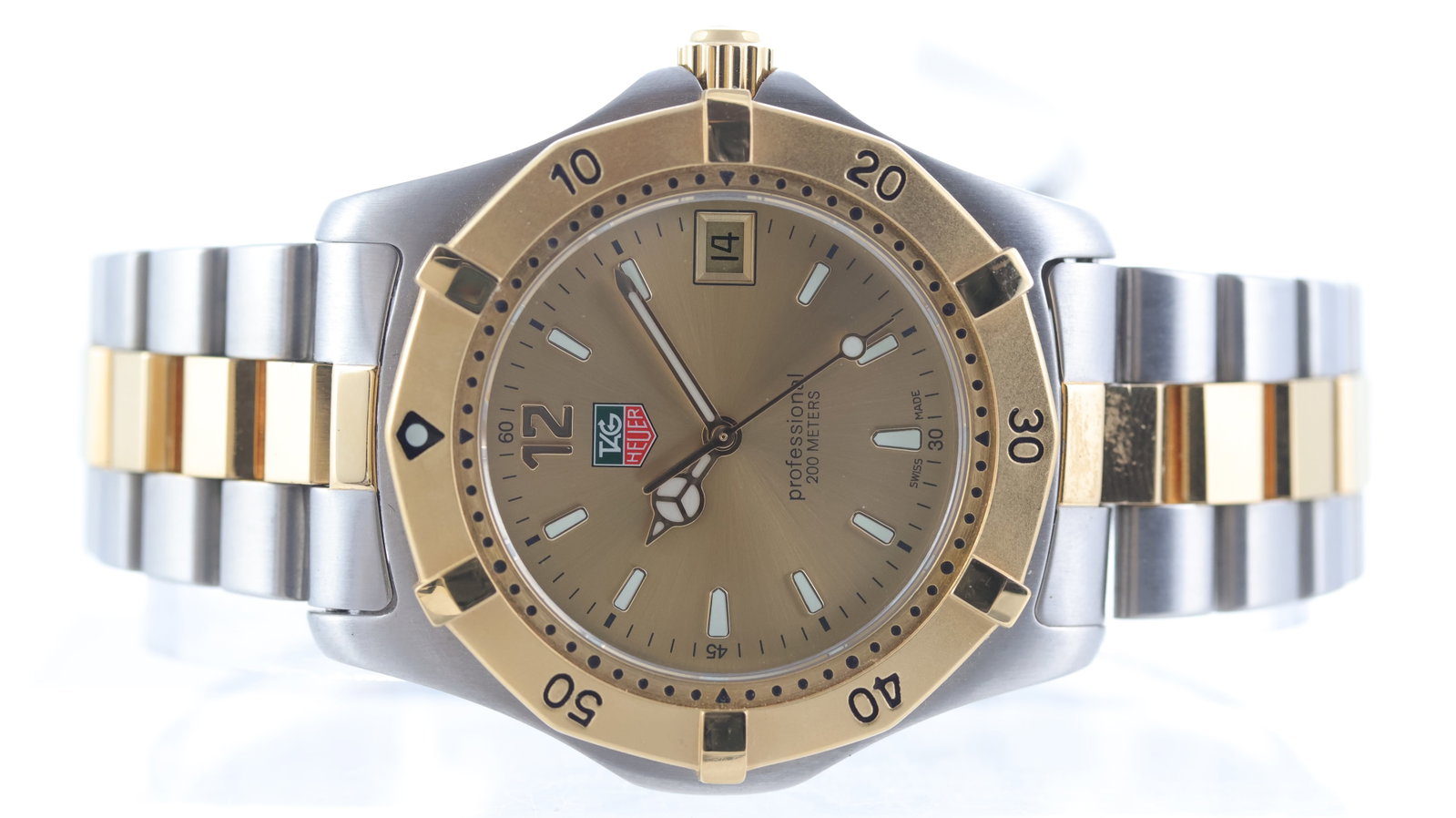 Tag Heuer Professional 200m Ref WK1121-1: Brand: Tag Heuer Model Name: Professional 200m Reference: WK1121-1 Movement type: Quartz Dial shape: Circular Dial colour: Champagne Dial features: Gilt mercedes hands and rounded hour markers. Date a