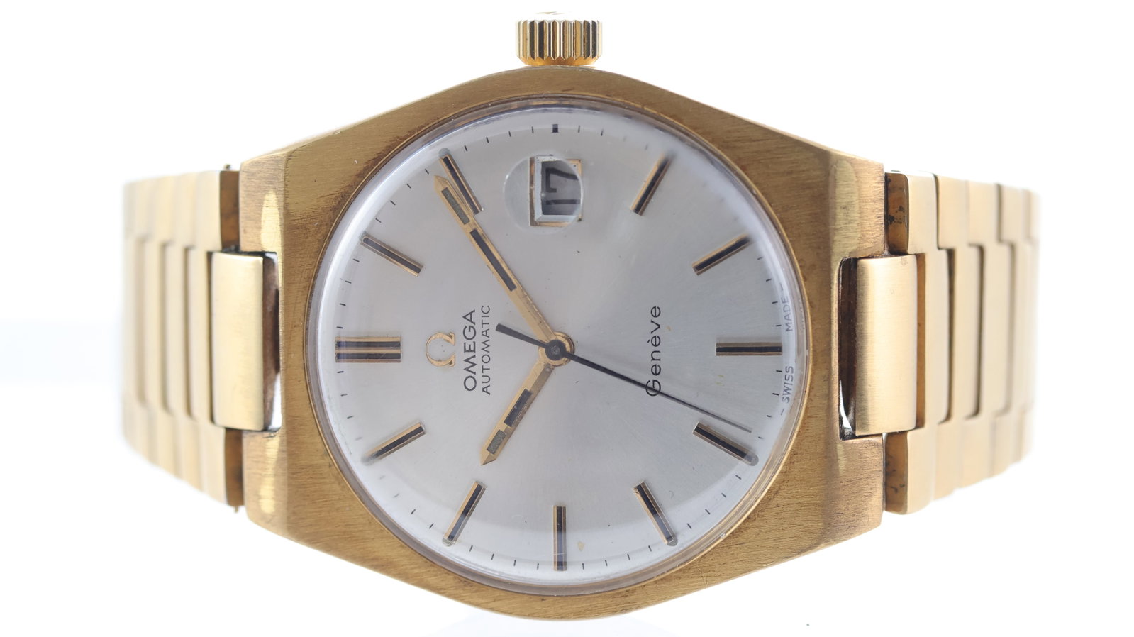 Vintage Omega Geneve Automatic Date: Brand: Omega Model Name: Geneve Movement type: Automatic Dial shape: Circular Dial colour: Silver Dial features: Applied baton hour markers with black inserts. Date aperture at 3 o'clock. Case size: 3