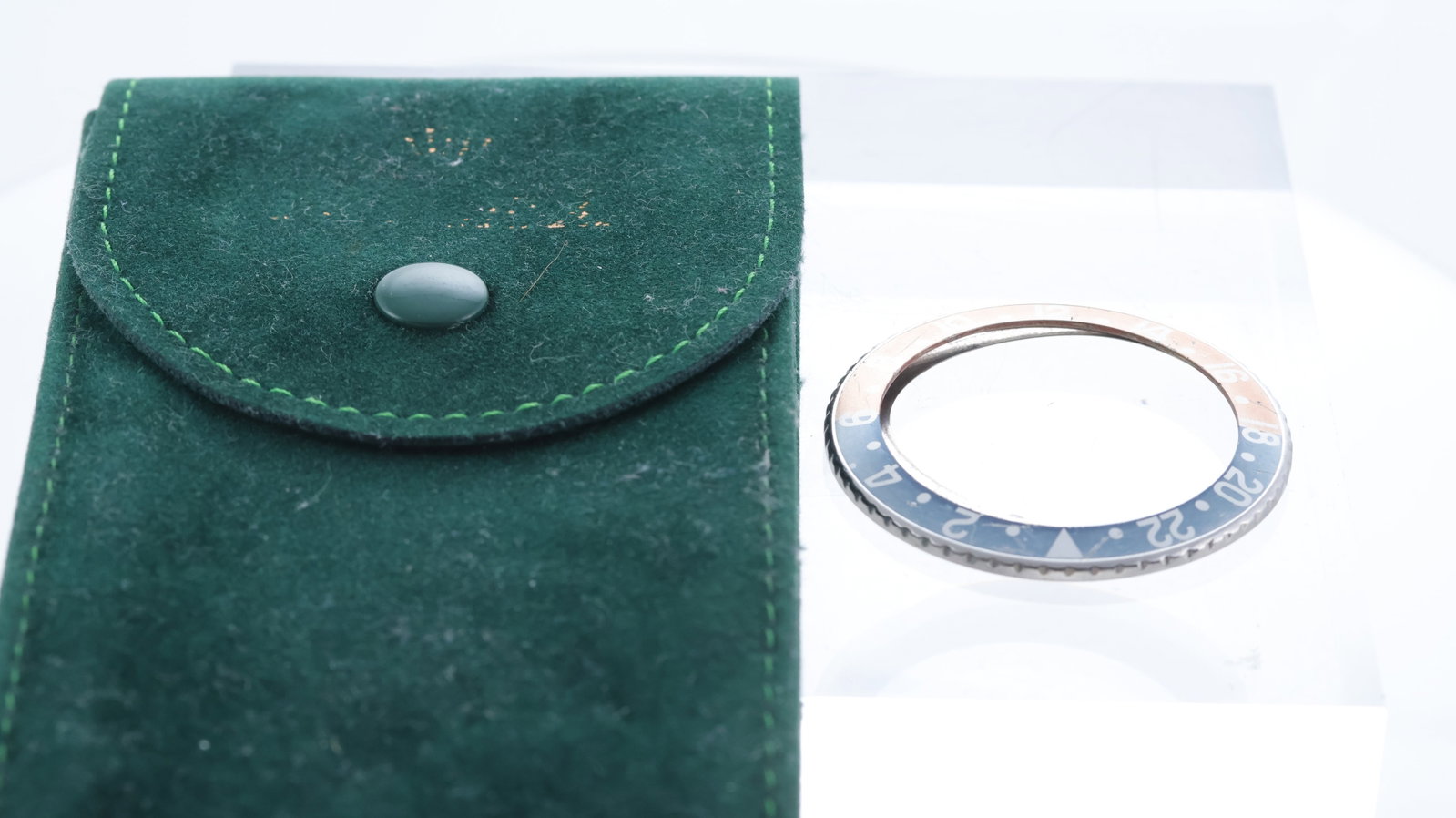 ROLEX GMT BEZEL AND INSERT + POUCH, faded Rolex GMT bezel, Red back, bezel and retaining ring, Green (1 of 4)