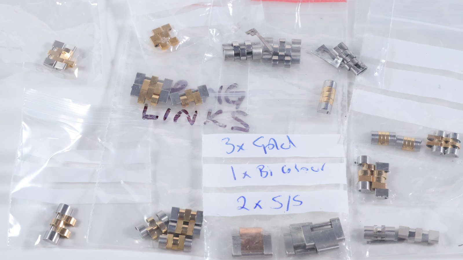 *To Be Sold Without Reserve* Job Lot of Rolex Watch Links: *To Be Sold Without Reserve* Job Lot of Rolex Watch Links, Sold as Seen, 28 links total, believed to be mainly Rolex Datejust links, including two solid gold examples and some oyster links.
