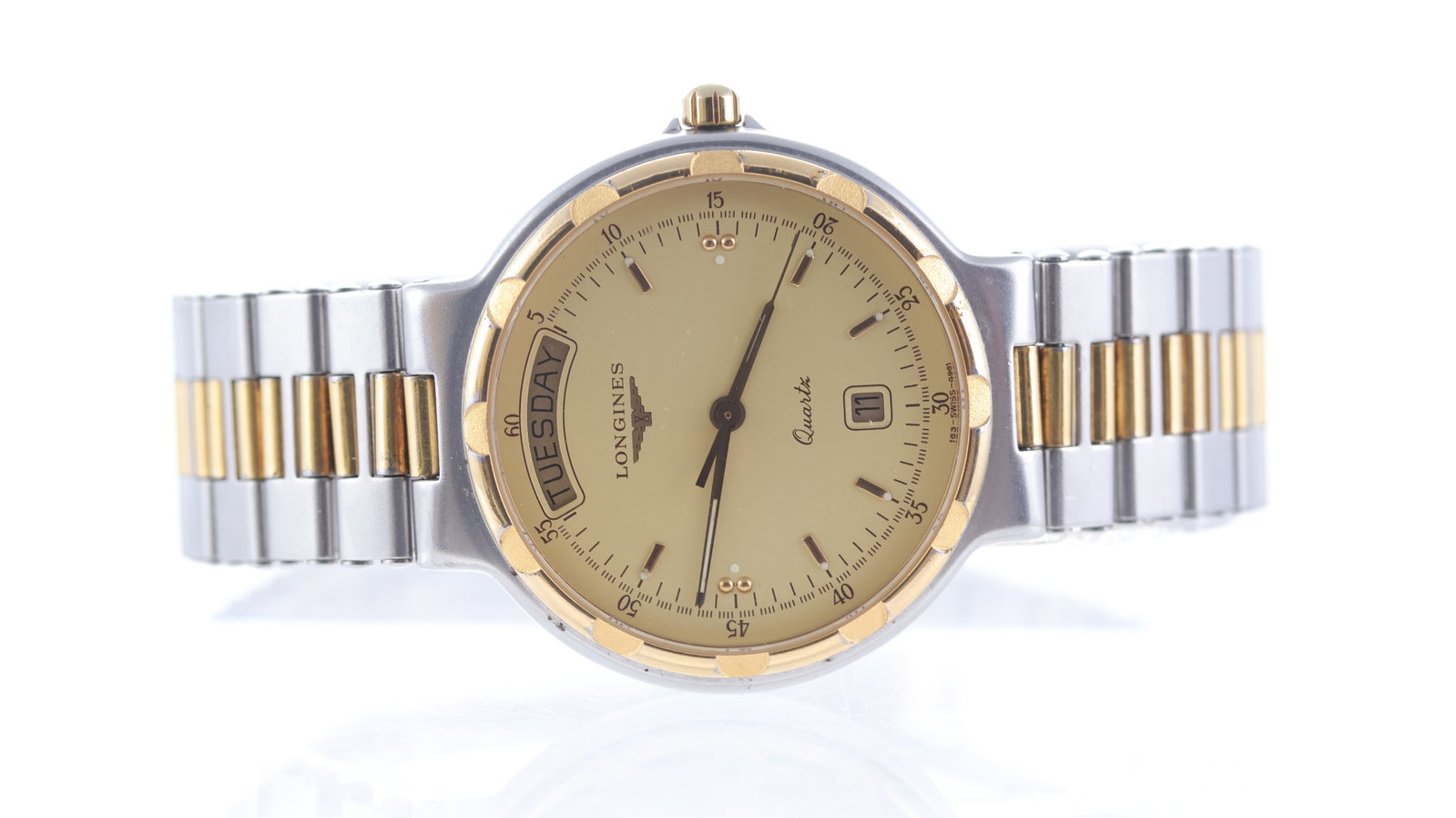 Longines Conquest Day Date: Brand: Longines Model Name: Conquest Movement type: Quartz Dial shape: Circular Dial colour: Champagne Dial features: Gold tone hands and baton hour markers. Date aperture at 3 o'clock, day aperture