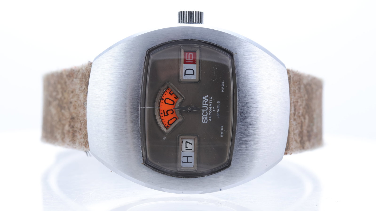 Vintage Sicura Jump Hour Automatic Circa 1970's: Brand: Sicura Model Name: Jump Hour Movement type: Automatic Year: Circa 1970's Dial shape: Cushion Dial colour: Grey Dial features: Hour, minutes and day aperture. Propeller seconds. Case size: 36mm