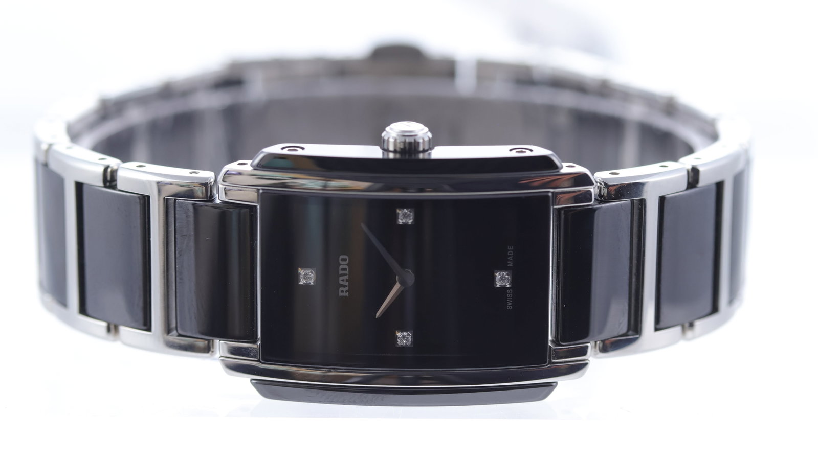 Ladies Rado Integral Ref 158.0613.3 with Box and Papers: Brand: Rado Model Name: Integral Reference: 158.0613.3 Movement type: Quartz Box: Full Box Papers: Full Set Papers Papers features: Unsigned/undated Dial shape: Rectangular Dial colour: Black Dial