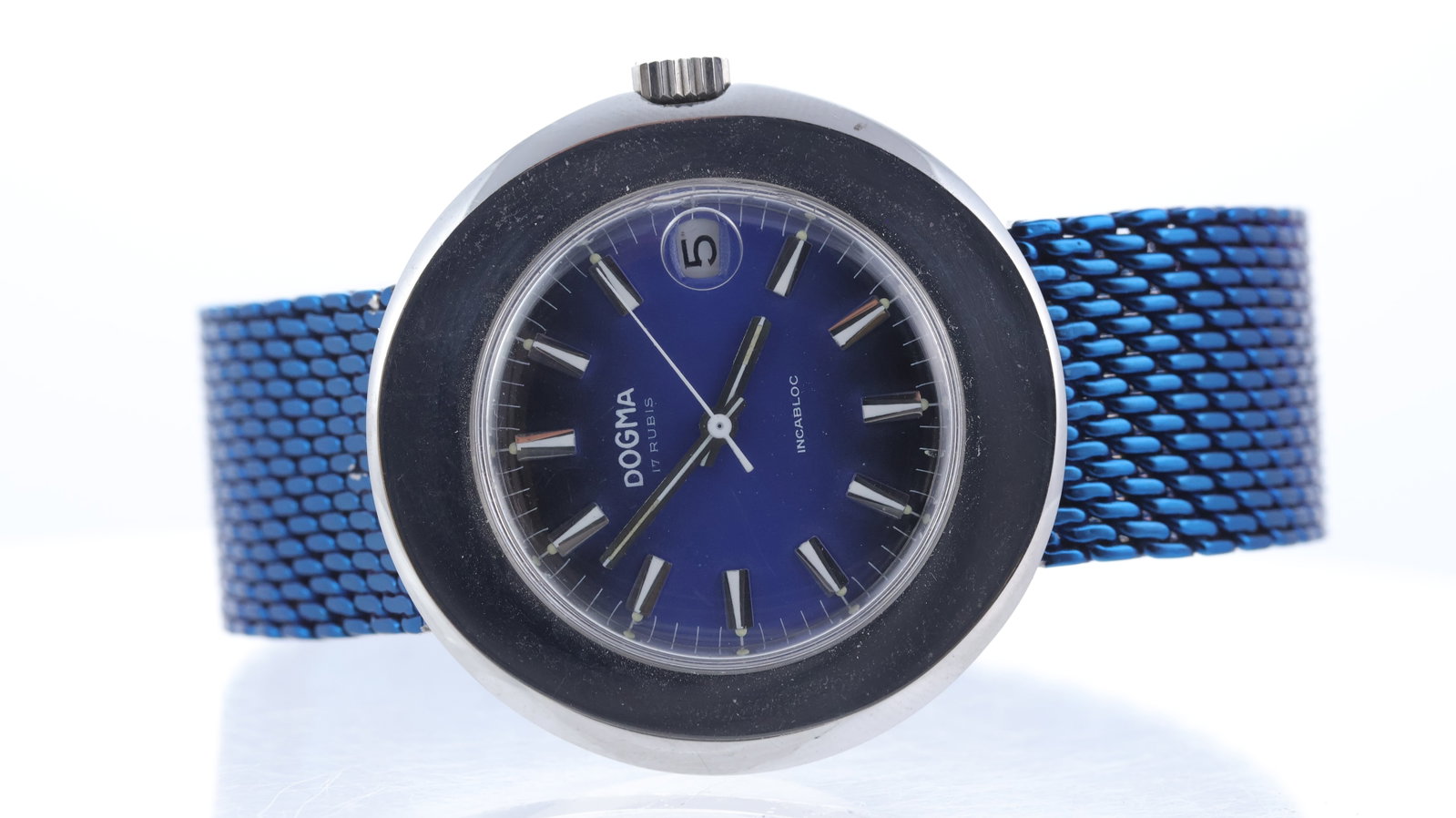 Vintage Dogma Manual Wind Ref 3369 Circa 1970's: Brand: Dogma Model Name: Incabloc Reference: 3369 Movement type: Manual Wind Year: Circa 1970's Dial shape: Circular Dial colour: Blue Dial features: Gradient dial. Applied hour markers. Date