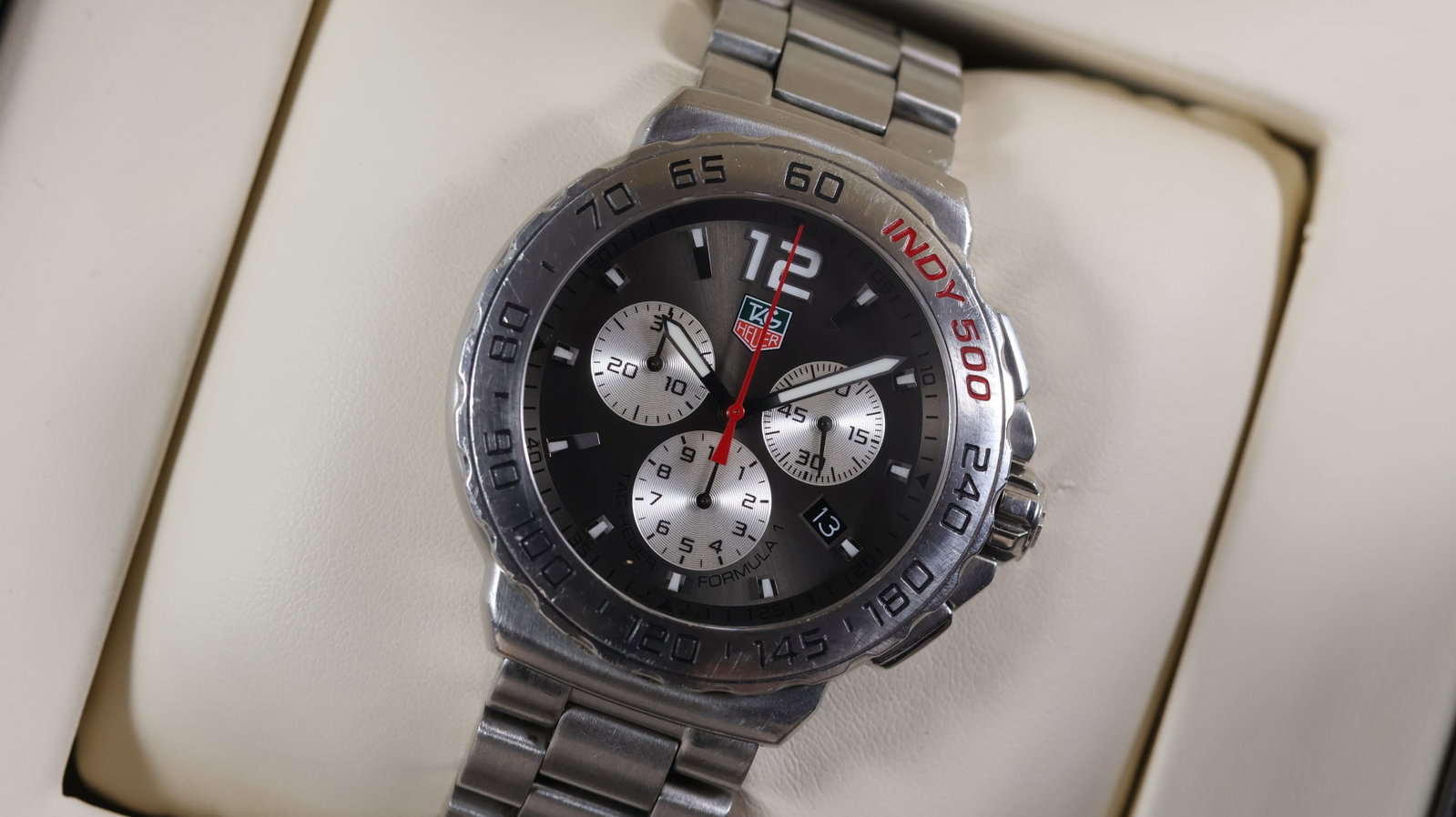 Tag Heuer Formula 1 'Indy 500' Ref CAU1113 with Box and Papers 2015: Brand: Tag Heuer Model Name: Formula 1 Reference: CAU1113 Movement type: Quartz Year: 2015 Box: Full Box Papers: Full Set Papers Dial shape: Circular Dial colour: Grey Dial features: Sunburst dial wit