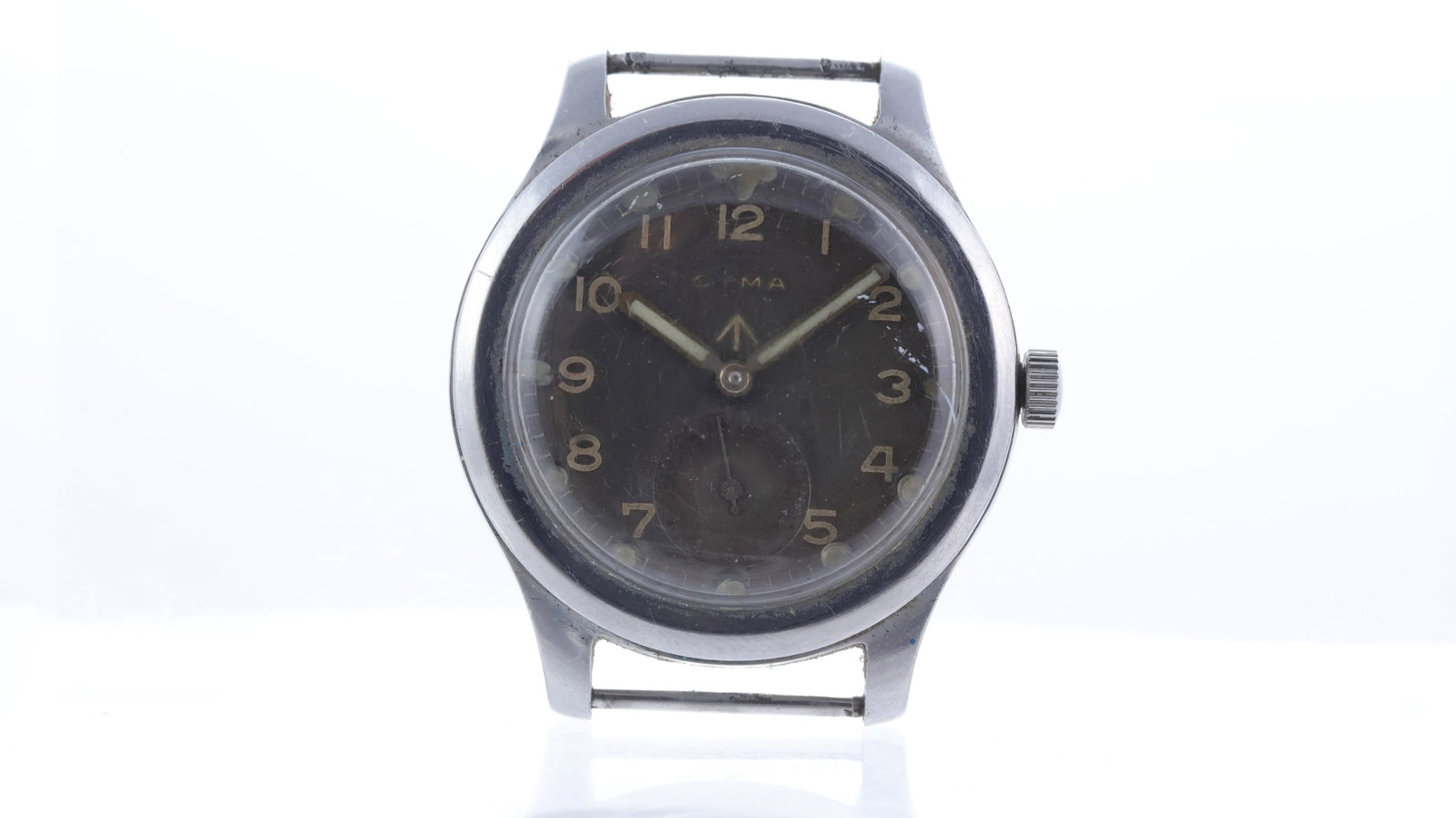 Vintage Cyma British Military 'Dirty Dozen' Circa 1945: Brand: Cyma Model Name: British Military 'Dirty Dozen' Movement type: Manual Wind Movement calibre: Cyma 234 Year: Circa 1945 Dial shape: Circular Dial colour: Black Dial features: Arabic numerals, su