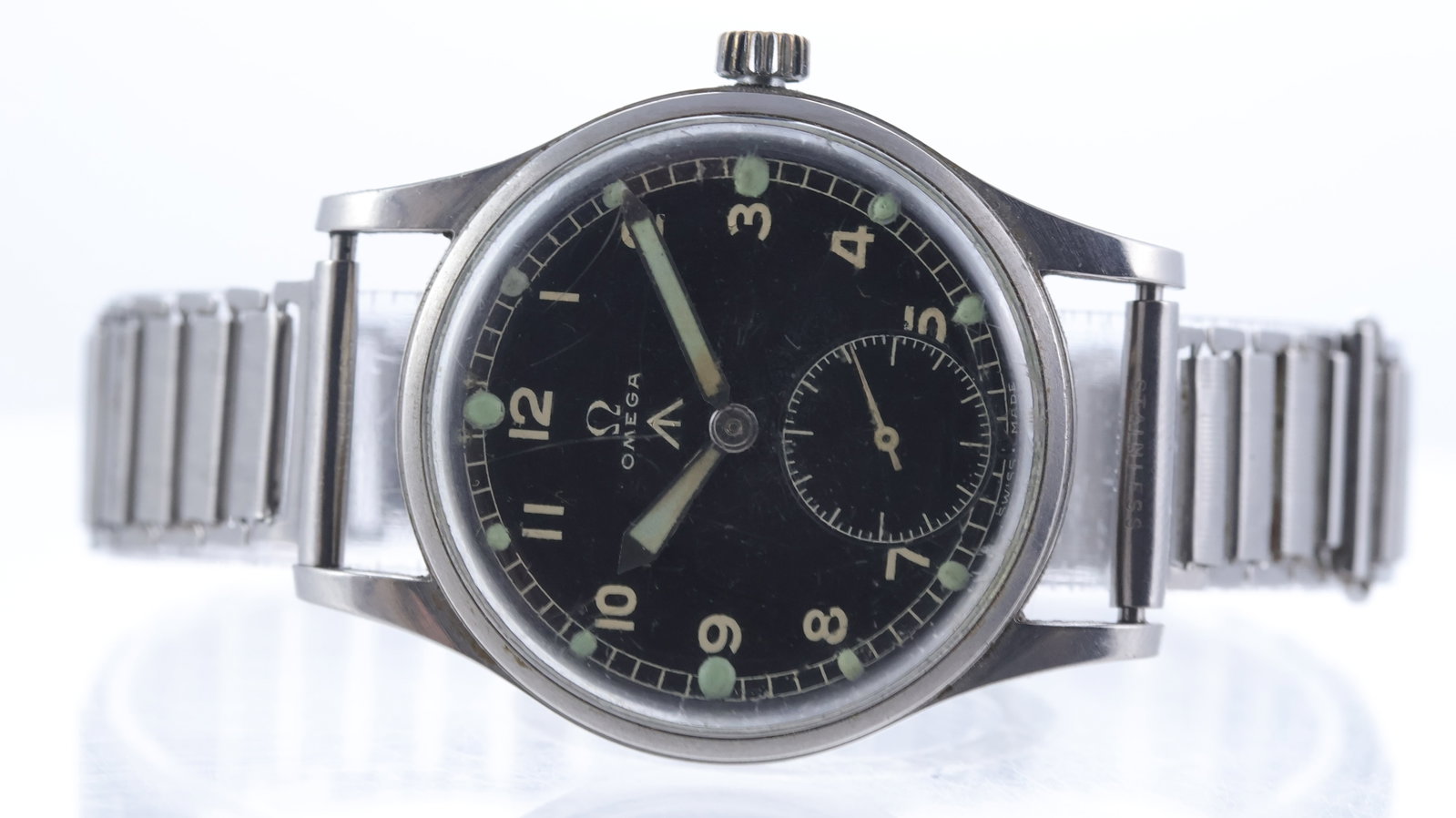 Vintage Omega British Military 'Dirty Dozen' Circa 1945: Brand: Omega Model Name: WWW 'Dirty Dozen' Movement type: Manual Wind Movement calibre: Omega 30T2 Year: Circa 1945 Dial shape: Circular Dial colour: Black Dial features: Arabic numerals, military bro