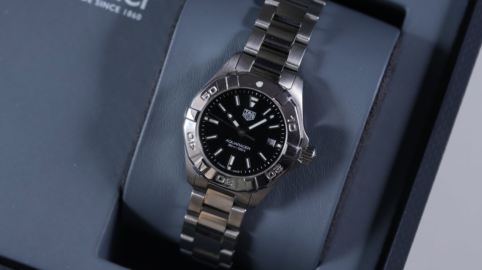Ladies Tag Heuer Aquaracer Ref WBD1410 with Box and Papers 2020: Brand: Tag Heuer Model Name: Aquaracer Reference: WBD1410 Movement type: Quartz Year: 2020 Box: Full Box Papers: Full Set Papers Dial shape: Circular Dial colour: Black Dial features: Applied baton ho