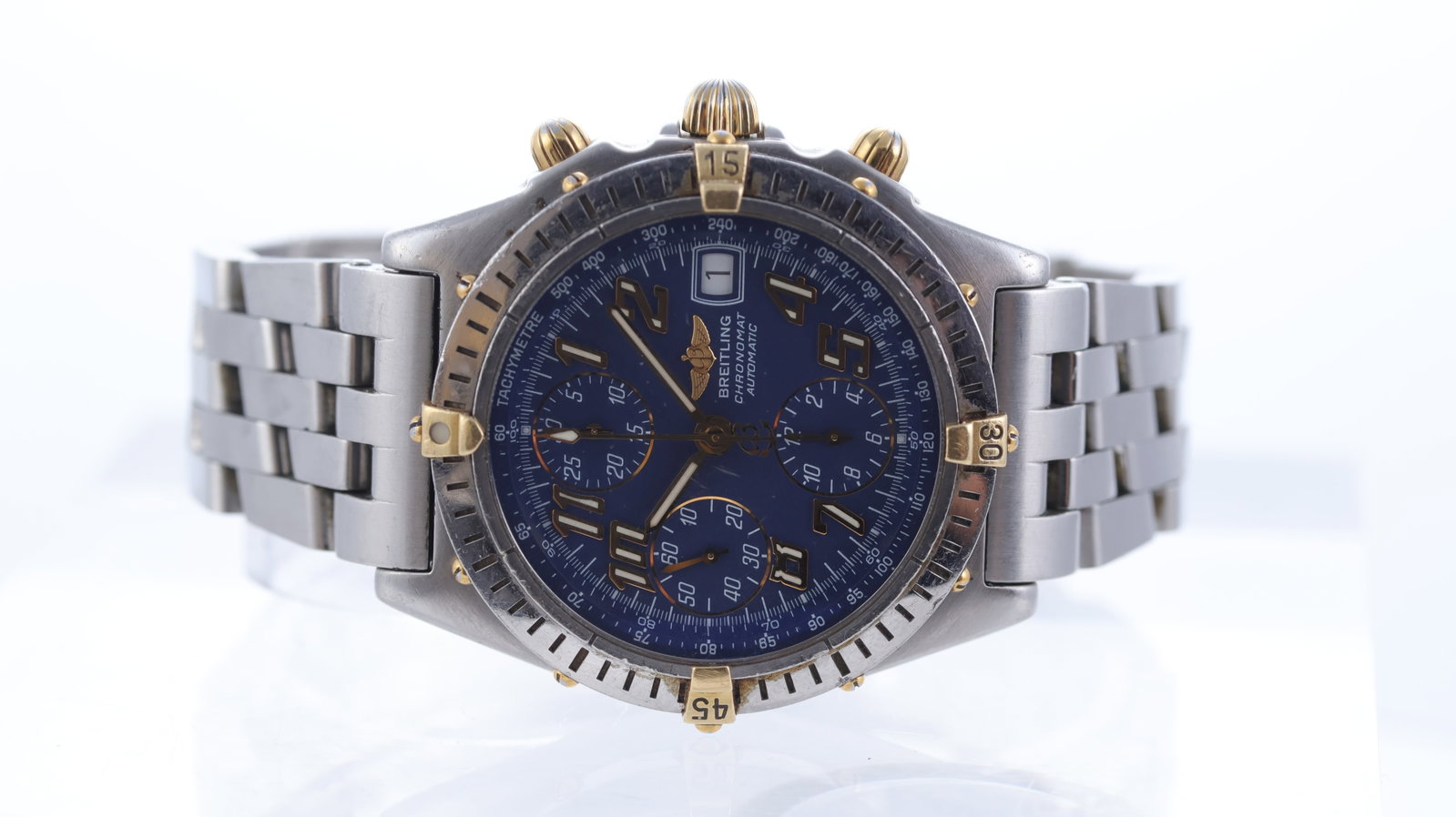Breitling Chronomat Ref B13350: Brand: Breitling Model Name: Chronomat Reference: B13350 Movement type: Automatic Movement calibre: Valjoux 7750 Dial shape: Circular Dial colour: Blue Dial features: Arabic numeral hour markers. Quic