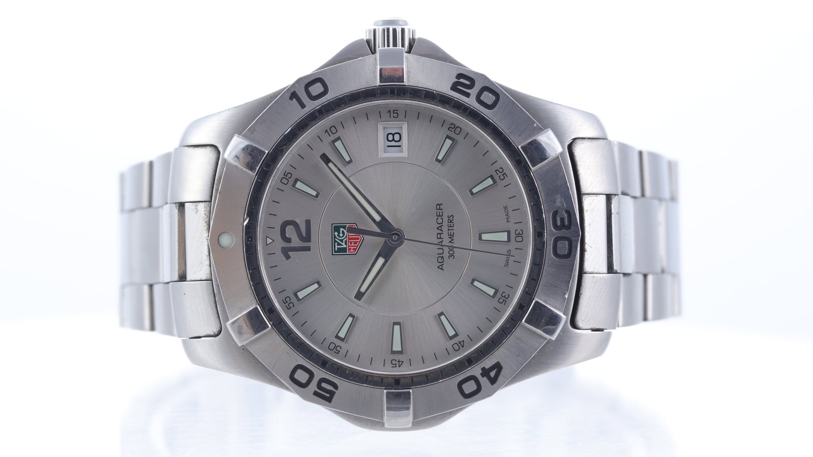 Tag Heuer Aquaracer Quartz Ref WAF1112: Brand: Tag Heuer Model Name: Aquaracer Reference: WAF1112 Movement type: Quartz Dial shape: Circular Dial colour: Sunburst, Silver Dial features: Lume filled hands and trapezium hour markers. Date ape