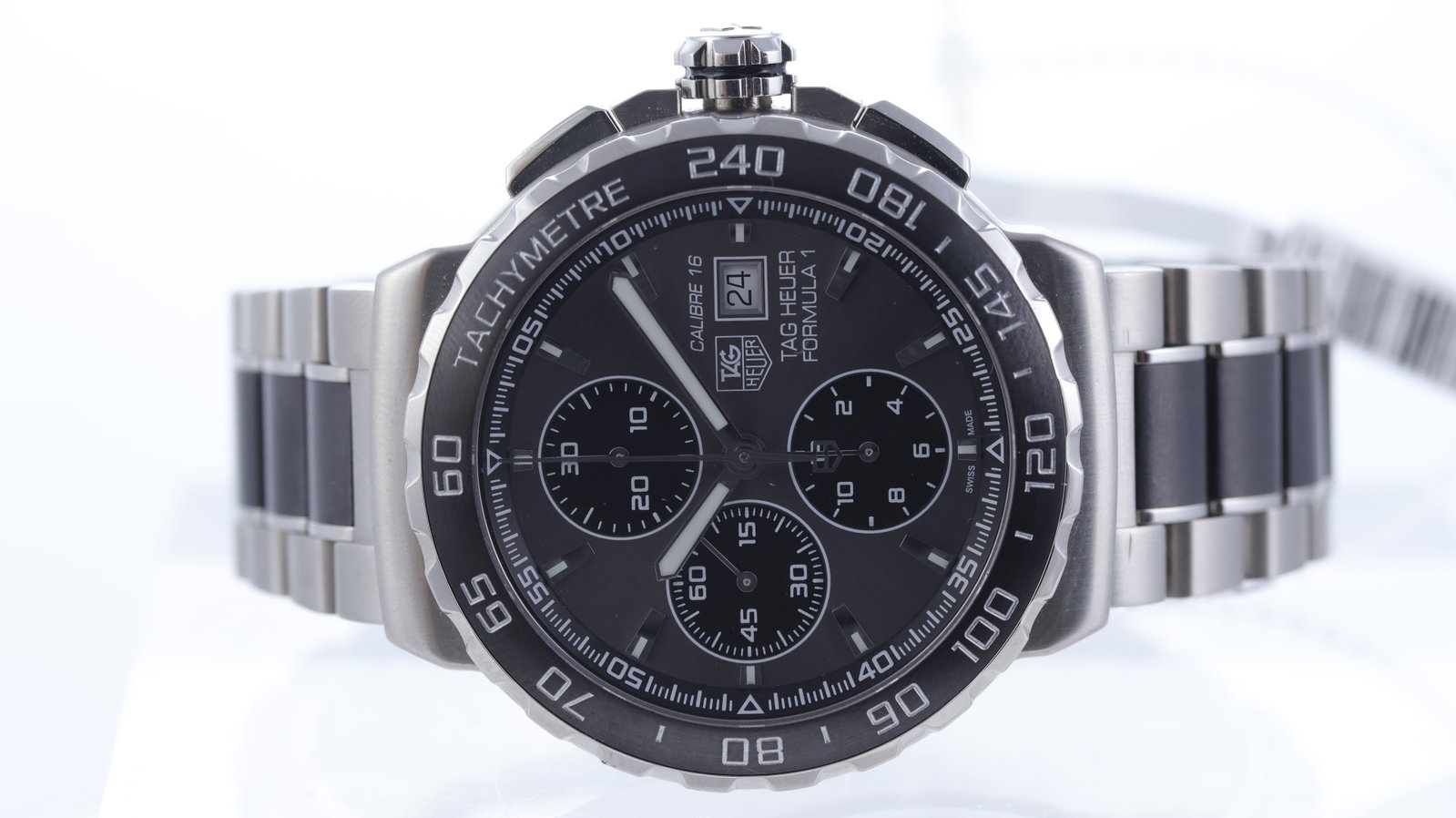 Tag Heuer Formula 1 Ref CAU2010-0 Automatic: Brand: Tag Heuer Model Name: Formula 1 Reference: CAU2010-0 Movement type: Automatic Movement calibre: Tag Heuer 16 Dial shape: Circular Dial colour: Grey Dial features: Sunburst dial with baton hour 