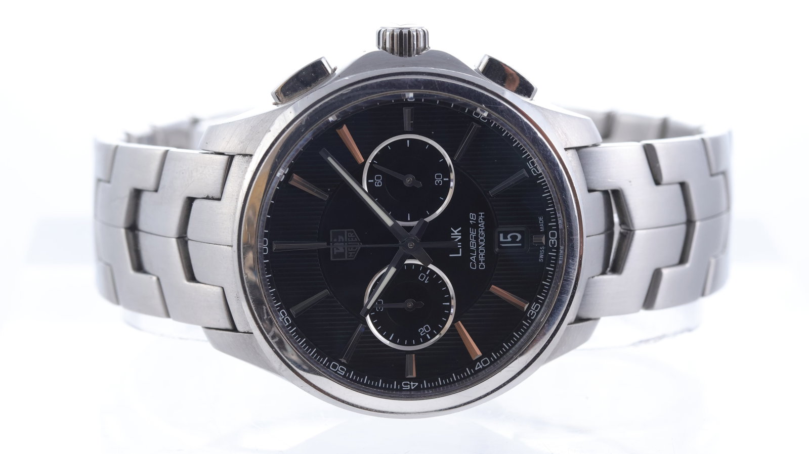 Tag Heuer Link Ref CAT2110: Brand: Tag Heuer Model Name: Link Reference: CAT2110 Movement type: Automatic Movement calibre: Tag Heuer 18 Dial shape: Circular Dial colour: Black Dial features: Striped dial with applied, faceted h