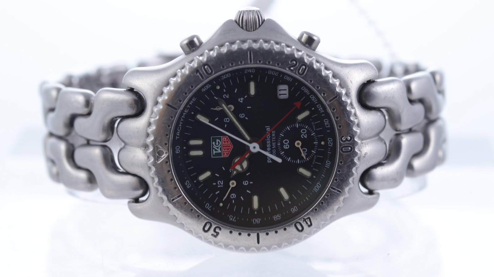 Tag Heuer SEL Ref CG1110-0: Brand: Tag Heuer Model Name: SEL Reference: CG1110-0 Movement type: Quartz Dial shape: Circular Dial colour: Black Dial features: Baton hour markers, three subsidiary dials, date aperture at 4 Bezel: 