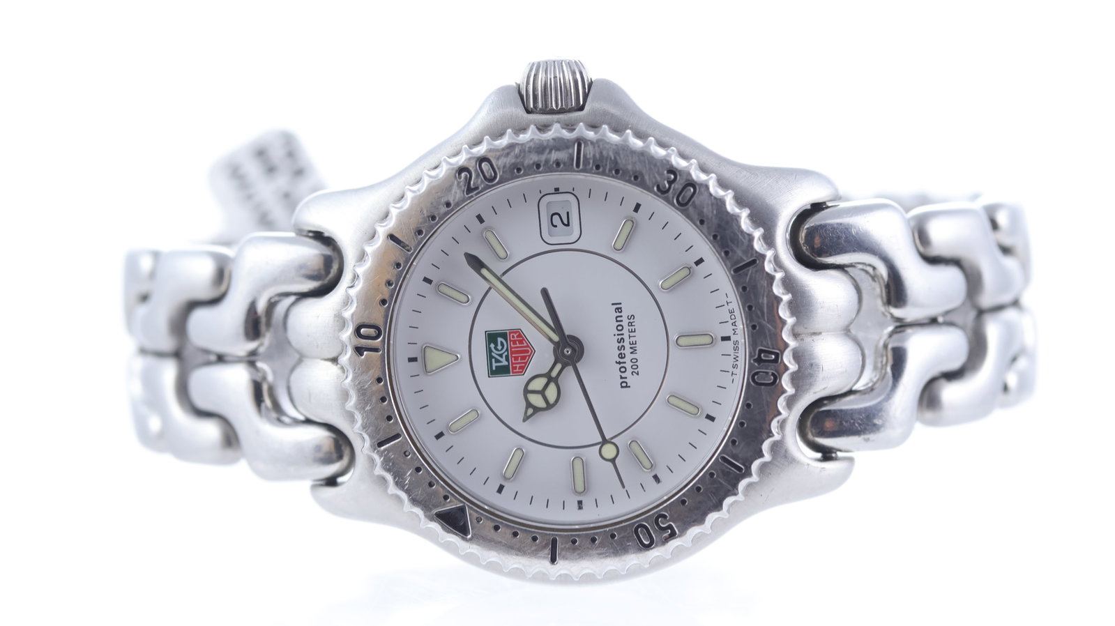 Tag Heuer Link Professional Ref WG1212-K0: Brand: Tag Heuer Model Name: Link Professional Reference: WG1212-K0 Movement type: Quartz Dial shape: Circular Dial colour: White Dial features: Mercedes hands. Applied oval hour markers with lume ins