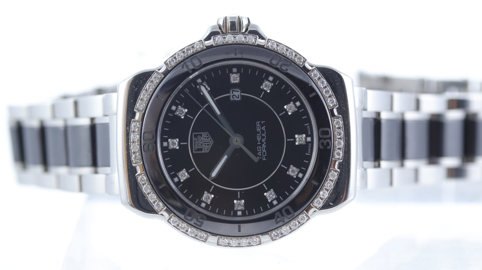 Tag Heuer Formula 1 Quartz Ref WAH1312: Brand: Tag Heuer Model Name: Formula 1 Reference: WAH1312 Movement type: Quartz Dial shape: Circular Dial colour: Black Dial features: Stone set hour markers. Date aperture at 3 o'clock. Bezel: Fixed 
