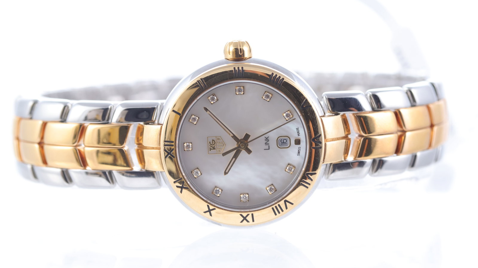Tag Heuer Link Ref WAT1453: Brand: Tag Heuer Model Name: Link Reference: WAT1453 Movement type: Quartz Dial shape: Circular Dial colour: Mother of pearl Dial features: Diamond dot hour markers, quickset date aperture at 6 o'cloc