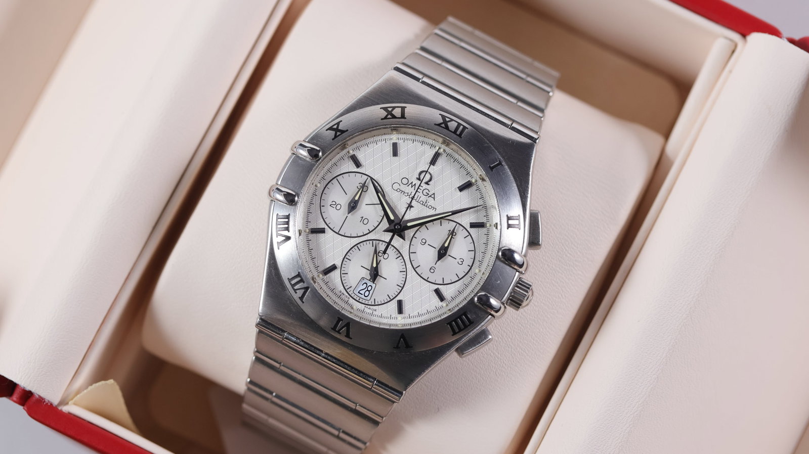 Omega Constellation Chronograph Quartz W/ Service Box: Brand: Omega Model Name: Constellation Movement type: Quartz Box: Service box Dial shape: Circular Dial colour: Silver Dial features: Guilloche dial with applied silver batons. Quick set date aperture