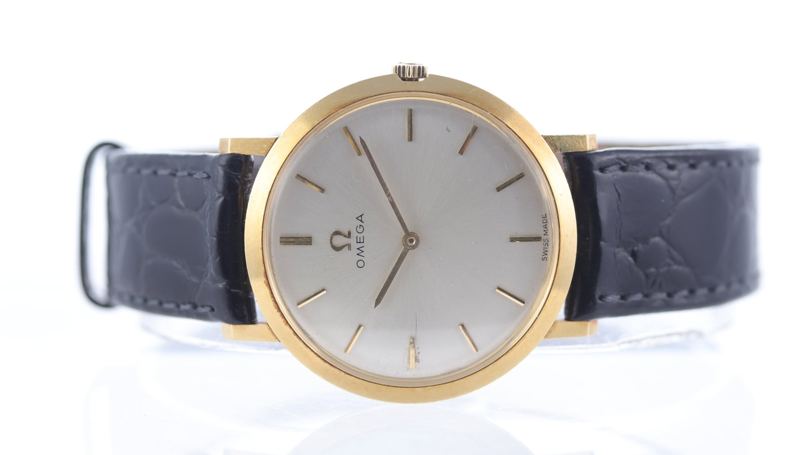 Vintage Omega Dress Watch 18ct yellow gold Ref 111.046 1965: Brand: Omega Model Name: Dress Watch Reference: 111.046 Movement type: Manual Wind Movement calibre: Omega 620 Year: 1965 Dial shape: Circular Dial colour: Silver Dial features: Applied baton hour