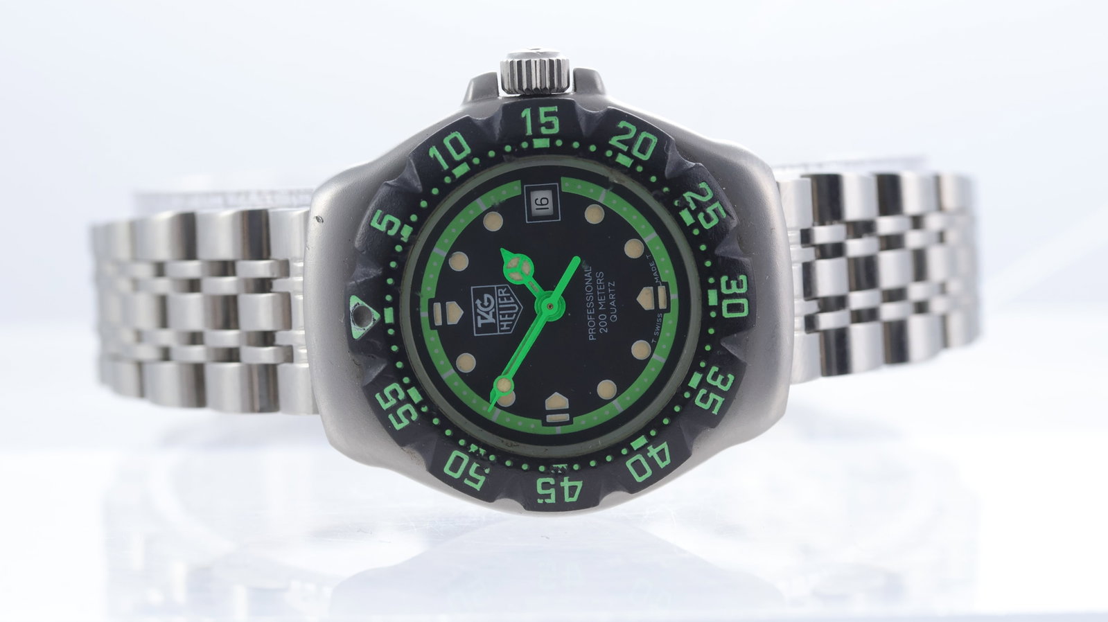 Tag Heuer Formula 'Ghostbuster' Quartz 1 Ref WA1415: Brand: Tag HeuerModel Name: Formula 1Reference: WA1415Movement type: QuartzDial shape: CircularDial colour: BlackDial features: Outer green minutes track. Mercedes hands. Date aperture at 3 o'clock.Be