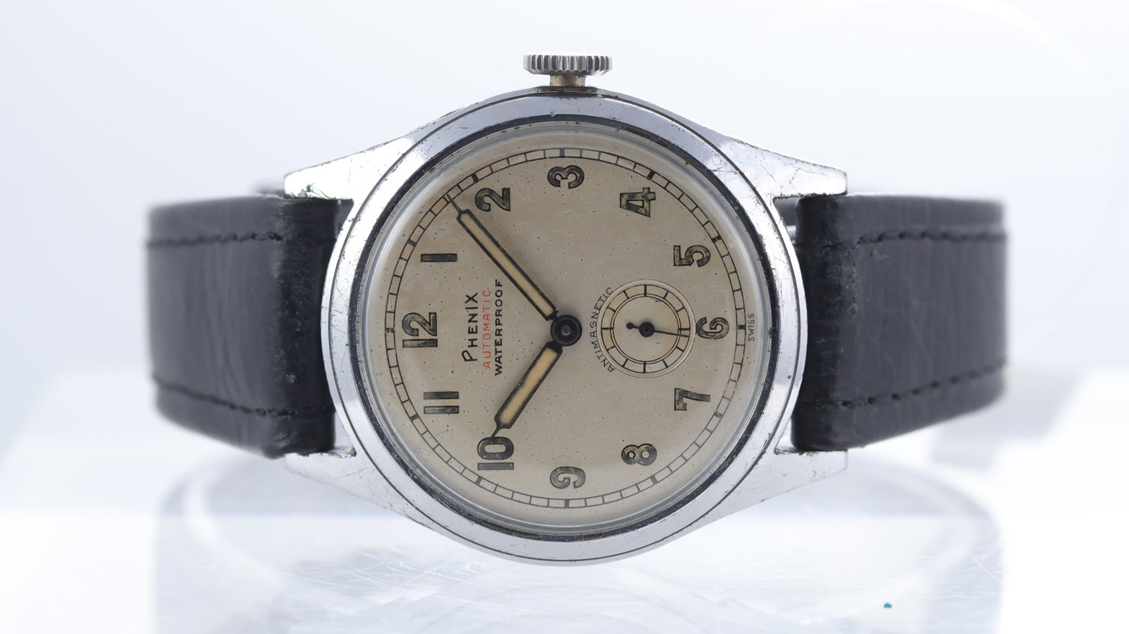 Vintage Phenix Military Style Watch Ref 3358 Circa 1940's: Brand: PhenixModel Name: Military Style WatchReference: 3358Movement type: AutomaticMovement features: EROS calibre 89Year: Circa 1940'sDial shape: CircularDial colour: Silver patinaDial features: Ara