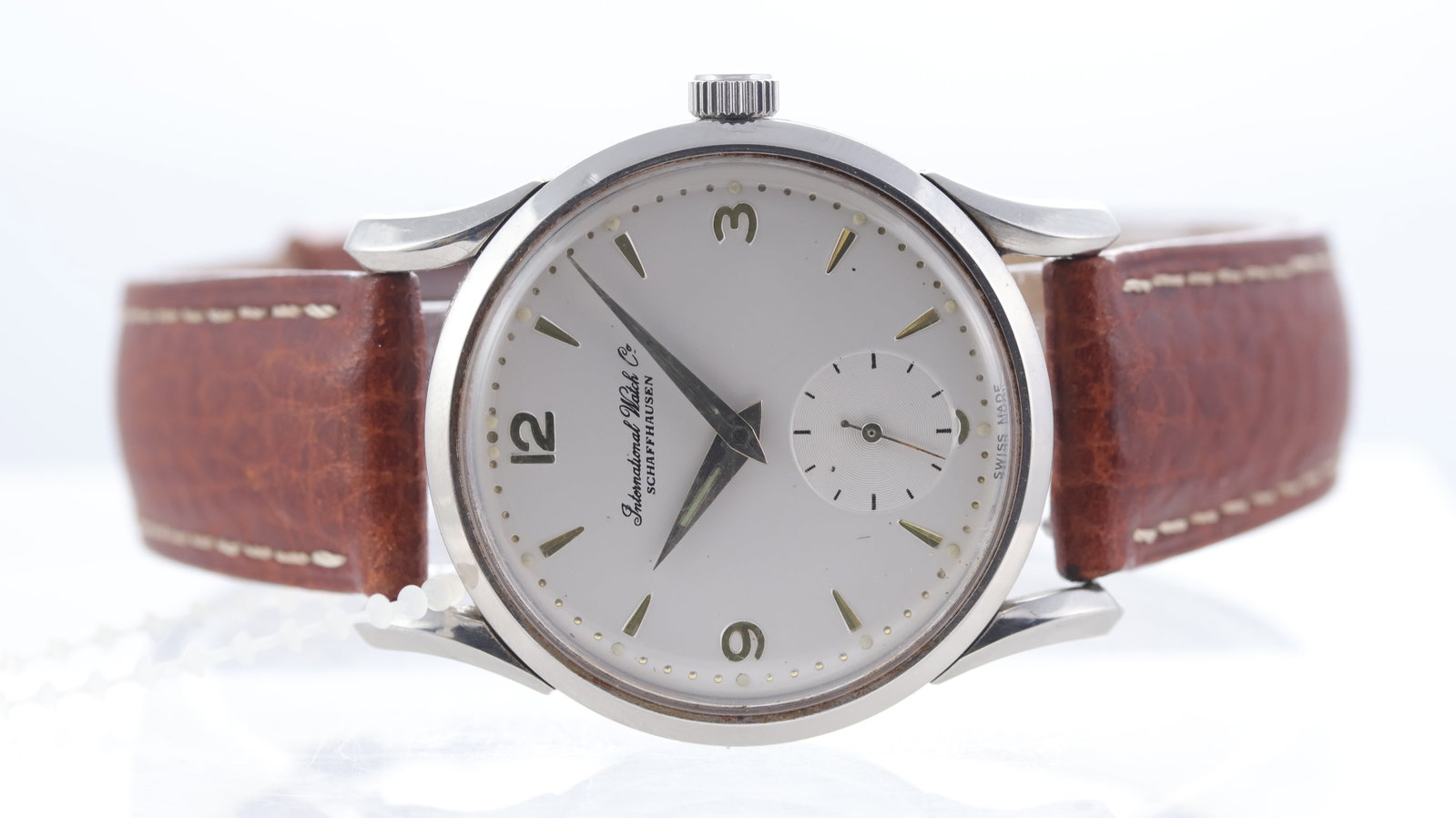 Vintage IWC Dress Watch Calibre 88 Circa 1950's: Brand: IWCModel Name: Dress WatchMovement type: Manual WindMovement calibre: IWC 88Year: Circa 1950'sDial shape: CircularDial colour: WhiteDial features: Baton hour markers with arabic numerals, subsi