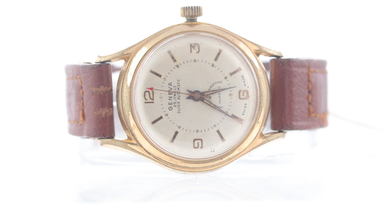 Vintage Geneva Felsa Calibre 1560 Automatic Circa 1950's: Vintage Geneva Felsa Calibre 1560 Automatic Circa 1950's, silver dial with gold baton and arabic numerals, 32mm gold capped case, brown leather strap, automatic calibre 1560, 25 jewels, currently runn
