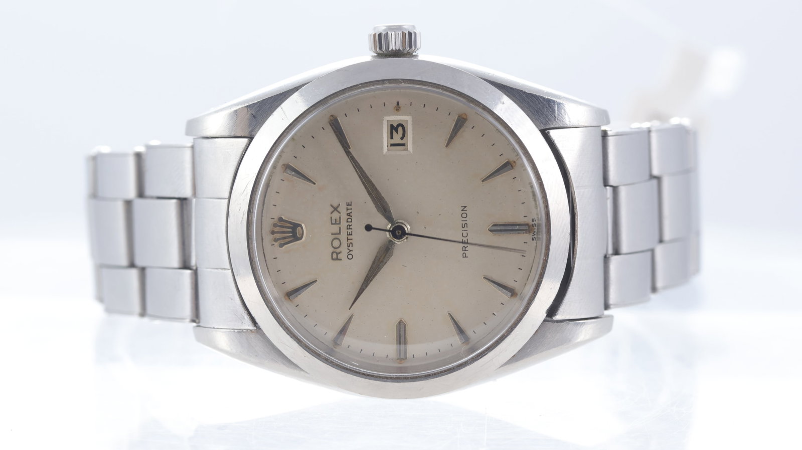 Vintage Rolex Oyster Date Precision Ref 6694 Circa 1960: Brand: RolexModel Name: Oyster Date PrecisionReference: 6694Movement type: Manual WindMovement calibre: Rolex 1215Year: Circa 1960Dial shape: CircularDial colour: SilverDial features: Patina dial with