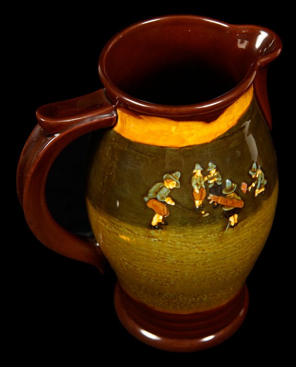 One Earthenware Pitcher by Royal Doulton: Title: One Earthenware Pitcher by Royal Doulton Author: ** Description: 'Kingsware' earthenware pitcher, approximately 9" tall.Image of a golfer and caddy on one side and an image of a group of golfer