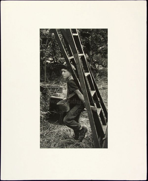 Original W. Eugene Smith photograph: Title: Untitled [Boy with a ladder, from Migrant Workers series] Author: Smith, W. Eugene (1918-1978) Description: Vintage silver print, approximately 13½x7¾" on a 14x11" sheet. Matted.Striking imag