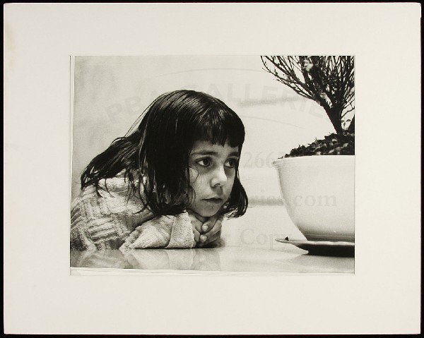 Eugene Smith photo of Juanita with Potted Plant: Title: Juanita with Potted Plant Author: Smith, W. Eugene (1918-1978) Description: Gelatin silver photograph. 10½x13¾ plus margins, matted.From Smiths "Friends and Family (My Daughter Juanita)" seri