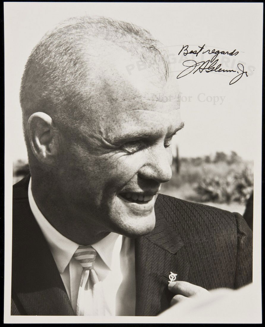 Signed photograph of astronaut John Glenn: Title: Signed photograph of astronaut John Glenn Author: Glenn, John Description: Black and white portrait photograph, approximately 10x8".Informal portrait photograph of Glenn wearing an Aurora 7 pin