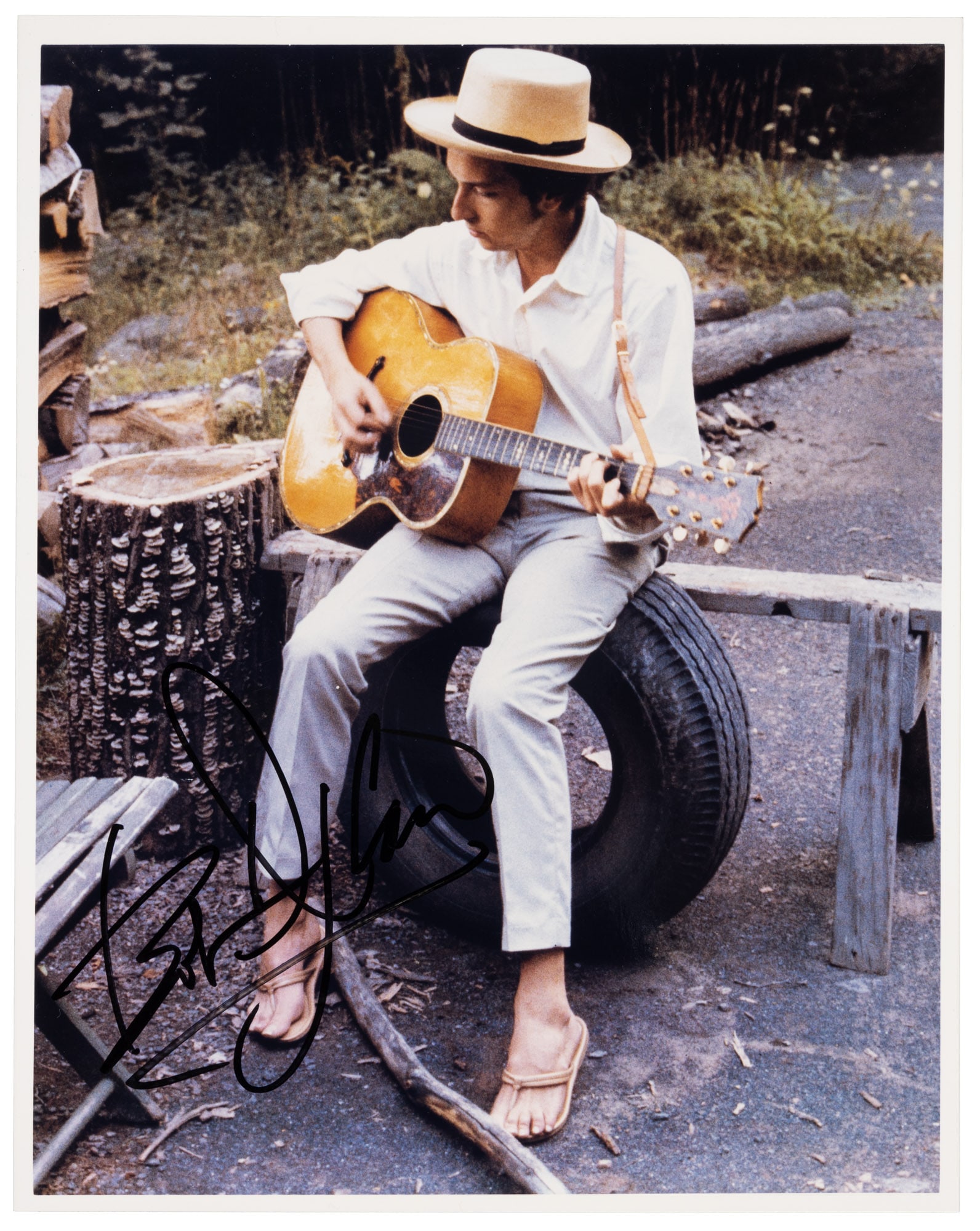 Photograph signed by Bob Dylan: Heading: (Dylan, Bob) Author: Title: Original photograph of Bob Dylan, signed Place Published: No place Publisher: Date Published: No date Description: Original color photograph. 2