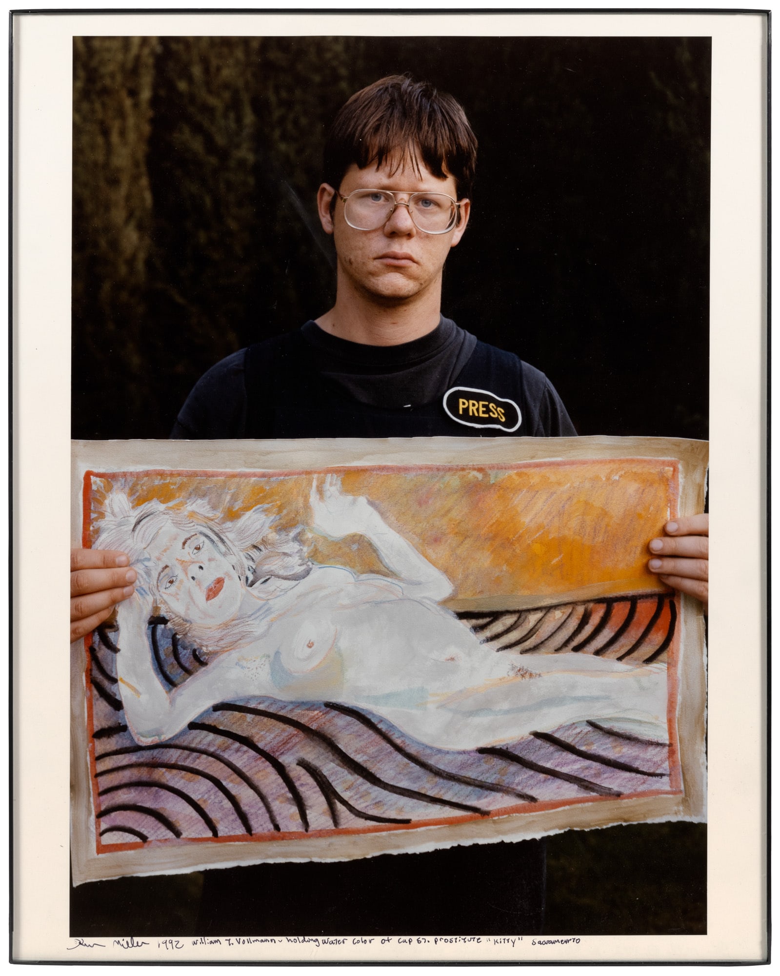 William Vollmann by Ken Miller - 1/5: Heading: (Vollmann, William) Author: Miller, Ken Title: Photograph of William Vollmann with painting Place Published: Sacramento Publisher: Date Published: 1992 Description: Color p