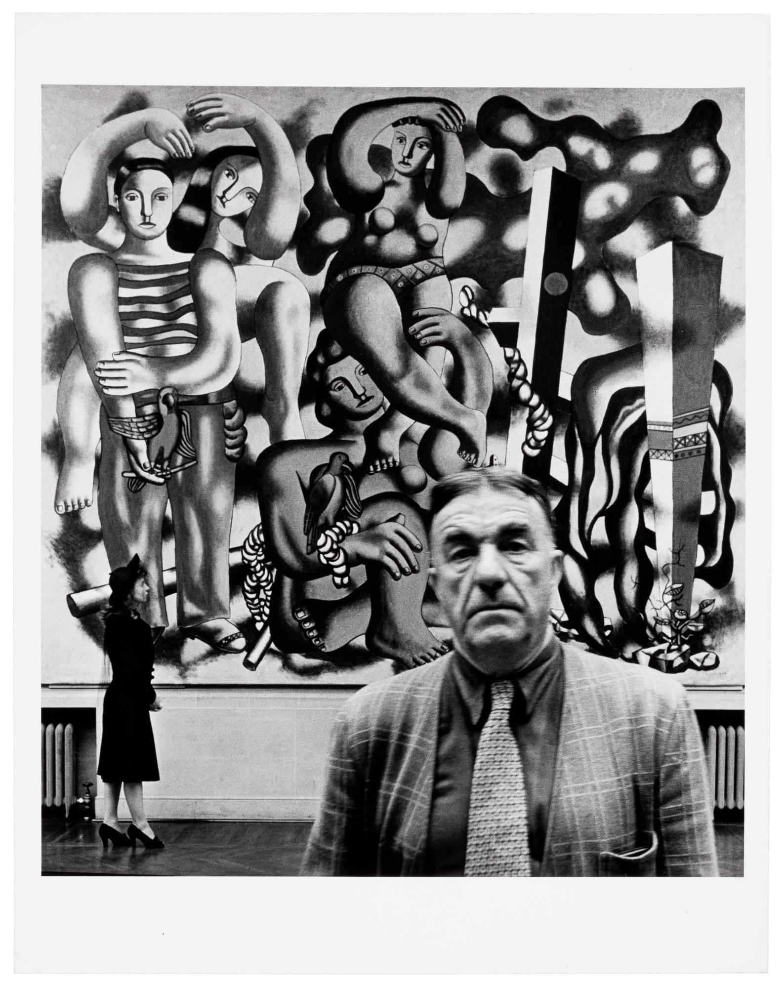 Signed by John Gutmann: Heading: Author: Guttman, John Title: Fernand Leger with Irene and "Composition with Parrots", 1940 Place Published: 1940" Publisher: Date Published: Description: 1940; later pri