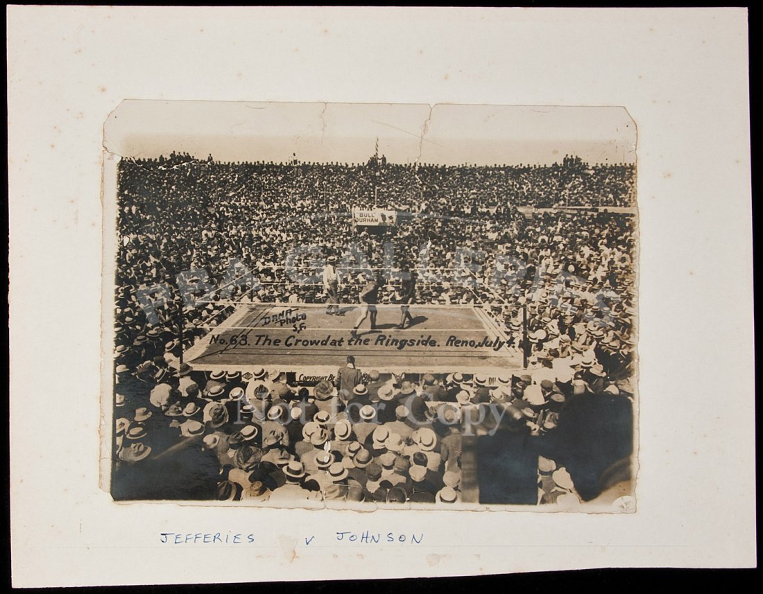 orig photo of Johnson-Jeffries boxing 1910: Title: Original photograph of the Johnson-Jeffries boxing match, July 4, 1910 Author: ** Description: Original albumen photograph, mounted to board. 17x23 cm (6¾x9"). Captioned within photograph, "Da