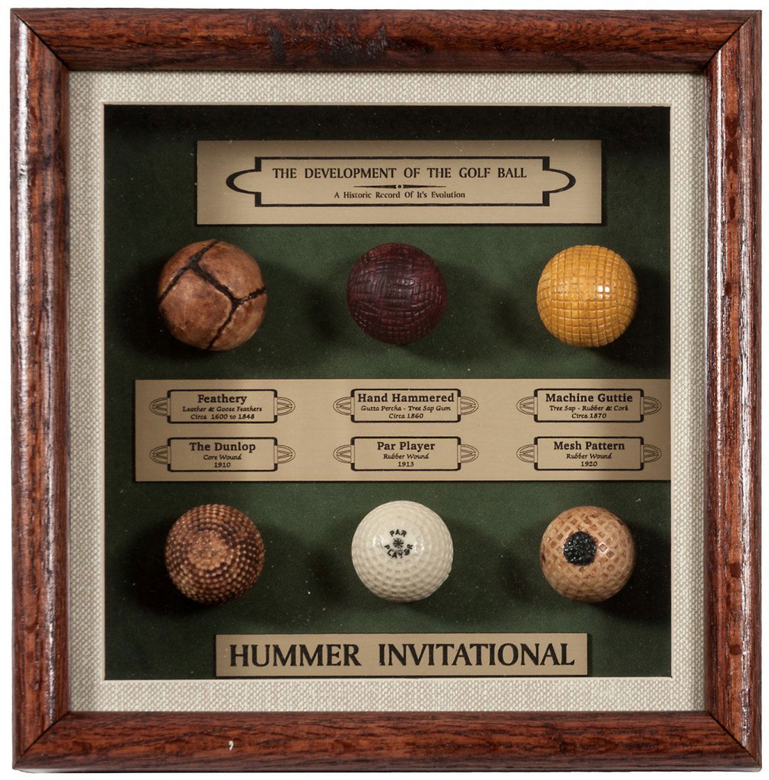 Display case with 6 replicas golf balls, History of the