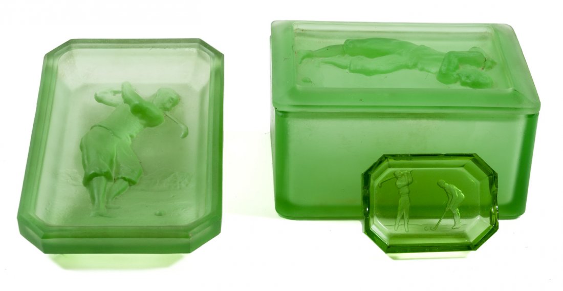 2 green glass ashtrays, 1 green glass box: Heading: (Smoking Accessories) Author: Hoffman, H. Title: Green glass ashtray with intaglio cut image of a golfer - plus two matching green glass items Place Published: Publisher:H. Hoffman Date