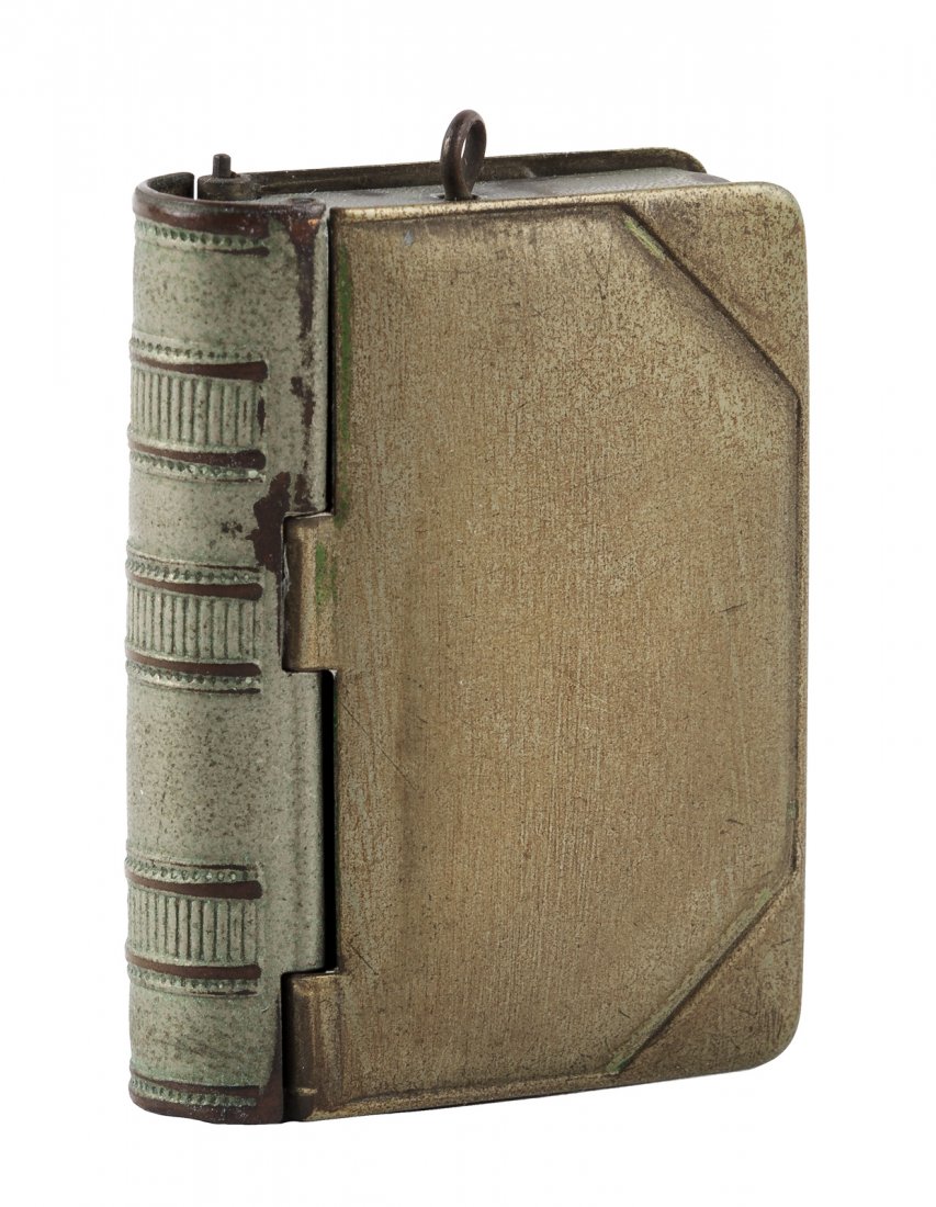 Book-shape locket box: Heading: (Locket) Author: Title: Book-shape locket Place Published: No place Publisher: Date Published: Late 19th century or early 20th century Description: 48x35 mm. Metal