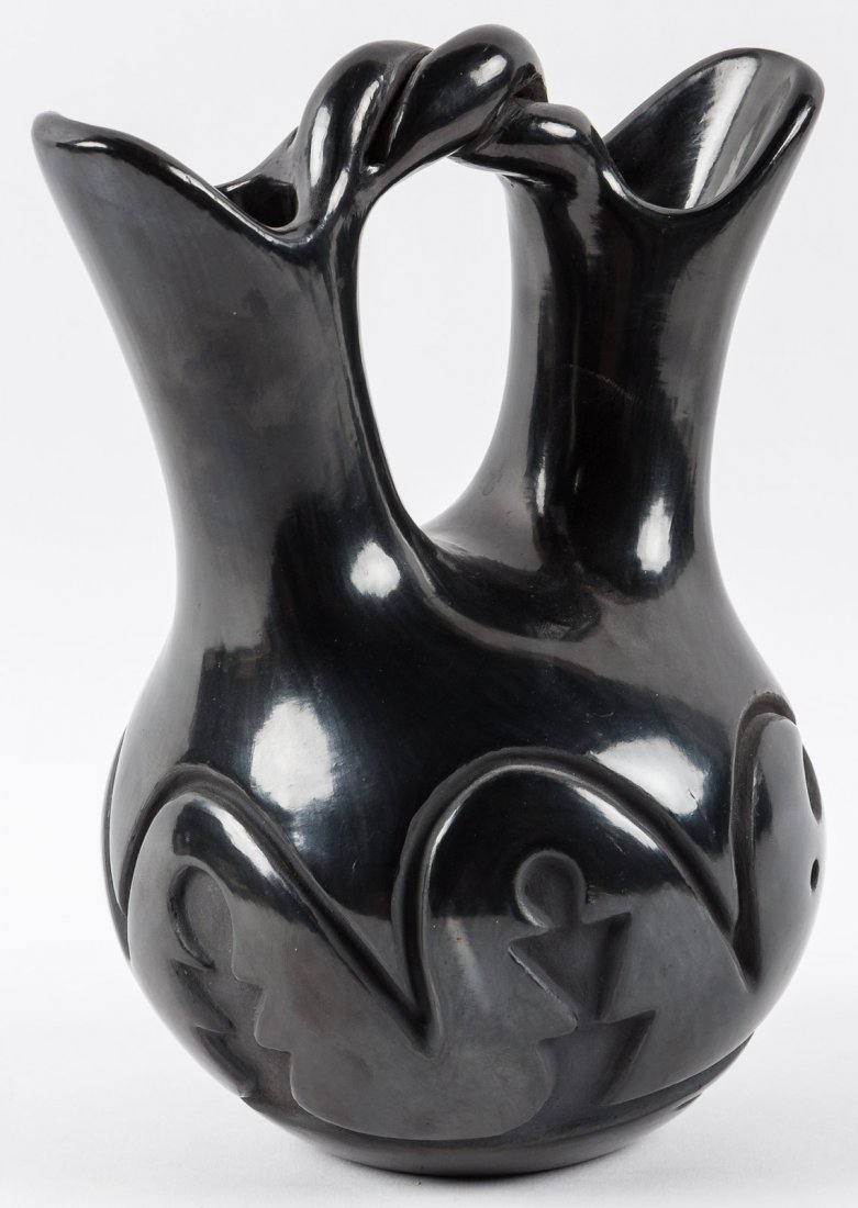 Santa Clara Pueblo stirrup jar by Helen Shupla: Heading: (Santa Clara) Author: Shupla, Helen Title: Large stirrup jar with deeply incised design Place Published: New Mexico Publisher:Santa Clara Pueblo Date Published: No date Descrip