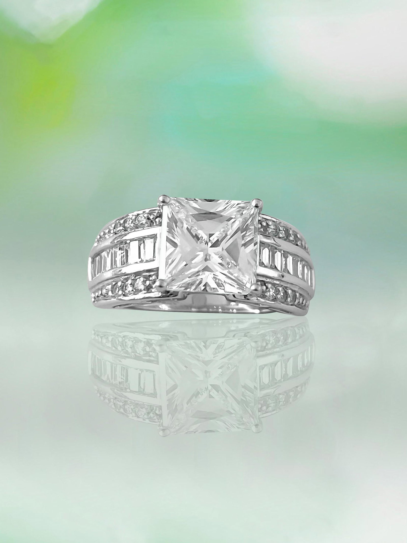 3.00 Carat Diamond & Solid Gold Ladies Engagement Ring: 10k solid white gold (tested). Center diamond: 3.00 carat American diamond. Princess cut diamond set in prongs. 100% eco friendly cubic zirconia diamond. Side diamonds: Round brilliant cut and baguett