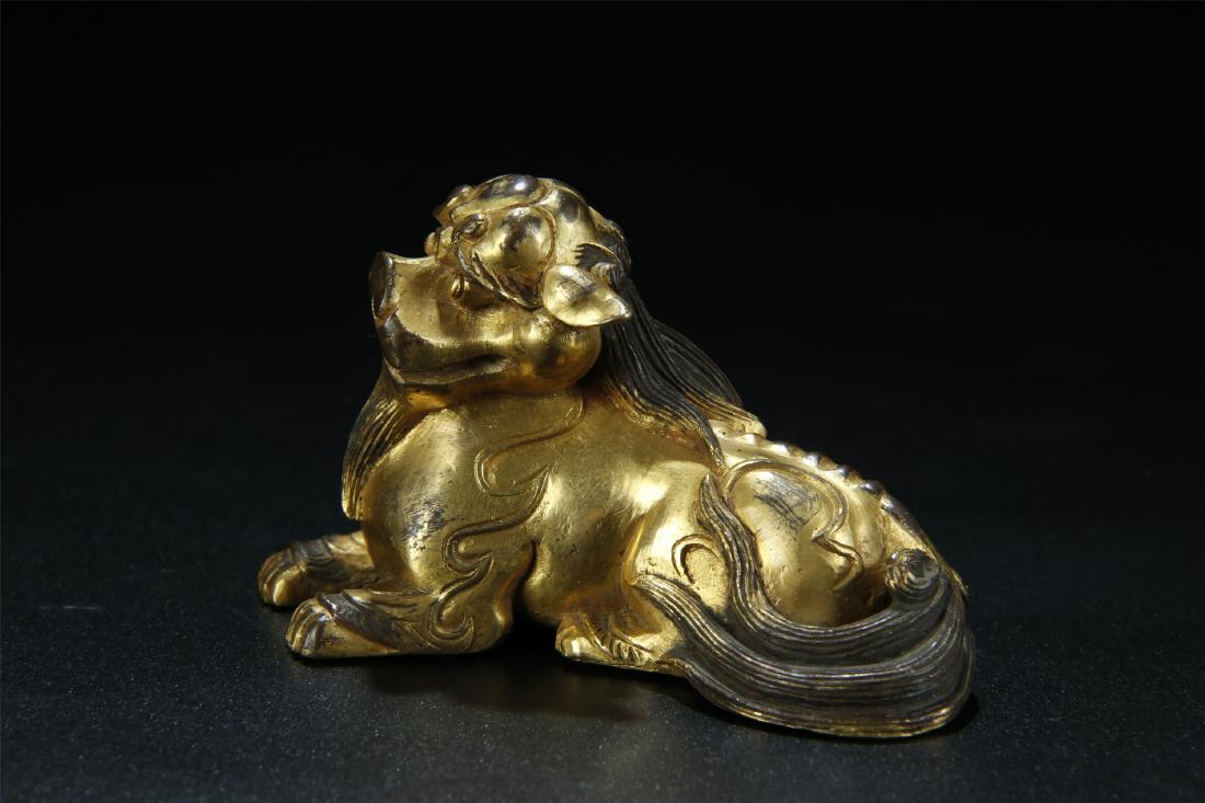 An old gilt bronze lion figure paperweight (1 of 8)