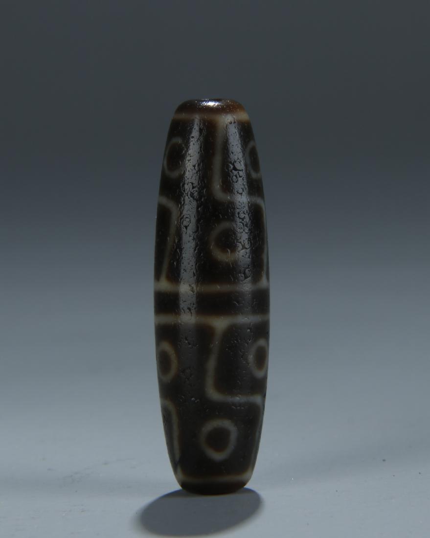 An old nine eyes Dzi bead; Tibet (1 of 7)