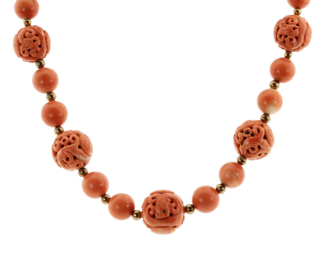 AN ANTIQUE CHINESE CARVED CORAL BEAD NECKLACE in yellow (1 of 1)